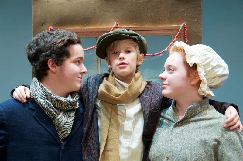 Chris Savino, Damien Alton and Katie MacLean play Bob, Tiny Tim and Ethel Cratchit in ORR's "A Christmas Carol." BY GEORGIA SPARLING